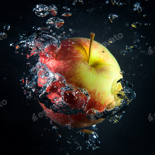 Preview: Apple is under water in a stream of air bubbles