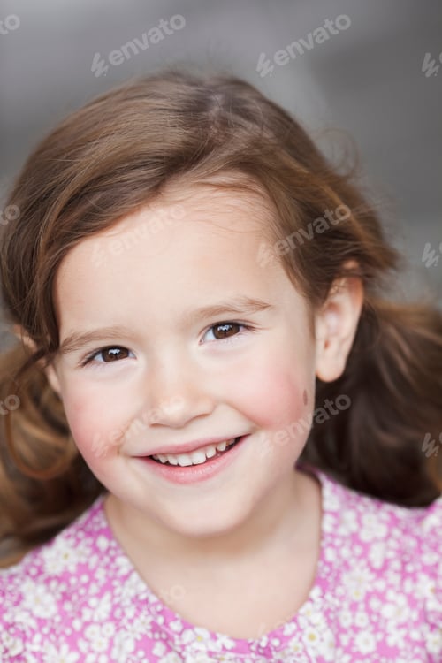 Preview: young girl smiling at viewer