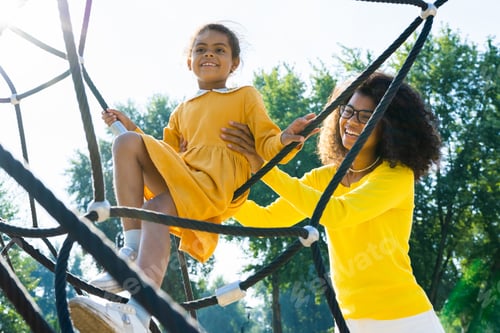 Preview: Beautiful happy african american family bonding at the park