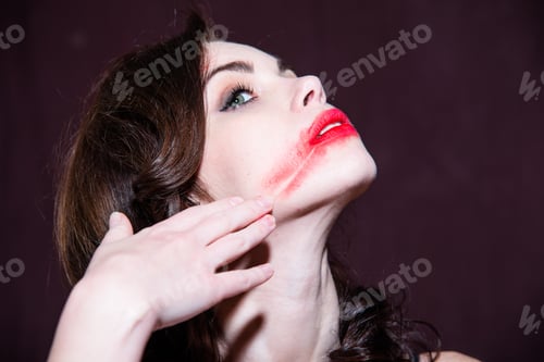 Preview: Young Girl Spreads Hand Red Lipstick On Her Lips