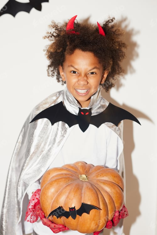 Preview: Portrait of African boy with devil horns