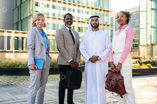 Preview: Group of multiethnic business people meeting an emirati businessman
