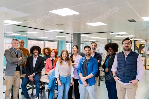 Preview: Diverse office team posing in coworking space.