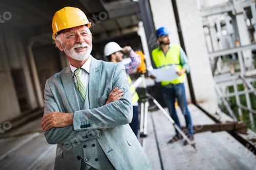 Preview: Engineer, foreman and worker discussing in building construction site