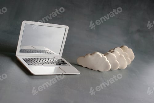 Preview: Laptop and white clouds.