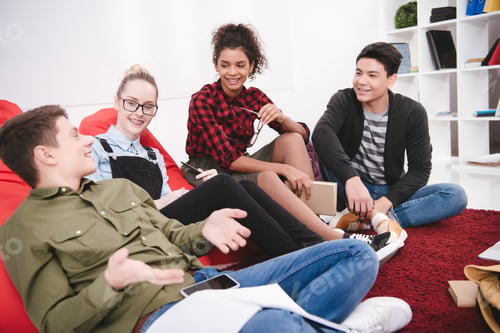 Preview: cheerful students sitting with exercise books