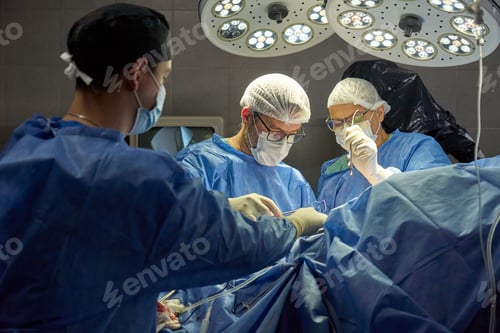 Preview: Surgeons Working in Operating Room under Bright Lights