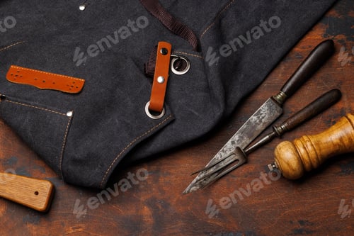 Preview: Meat cooking utensils on wooden table