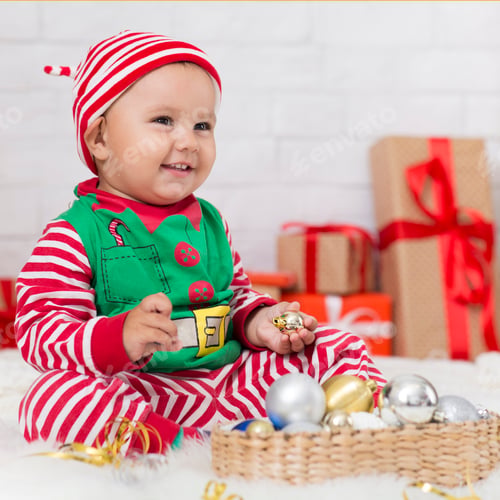 Preview: Cute baby elf playing with Xmas decorations
