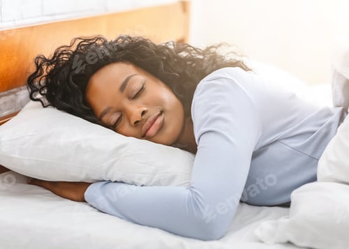 Preview: Peaceful afro girl sleeping in bed in morning
