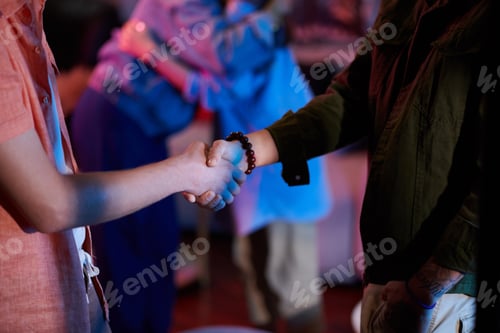 Preview: Young Men Shaking Hands