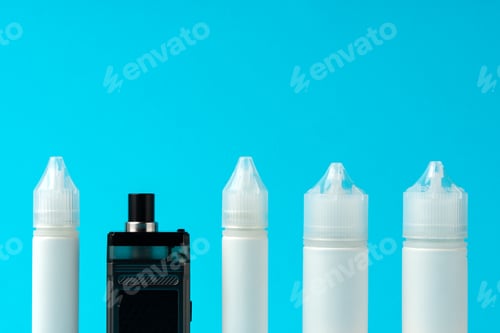 Preview: Electronic cigarettes liquid bottles on blue background