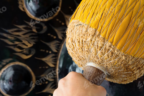 Preview: Hand hit big gong in temple
