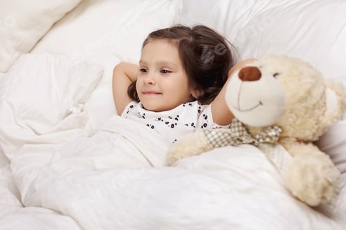 Preview: cute little child girl wakes up from sleep