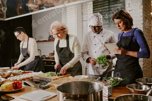 Preview: Diverse Group of Middle Aged Adults Participating in Cooking Class Together