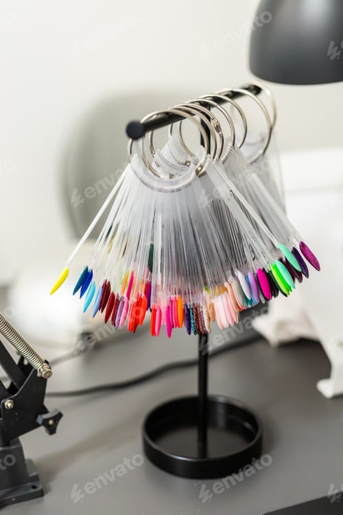Preview: Collection of nails color polish samples. A palette of nail designs of different colors with gel