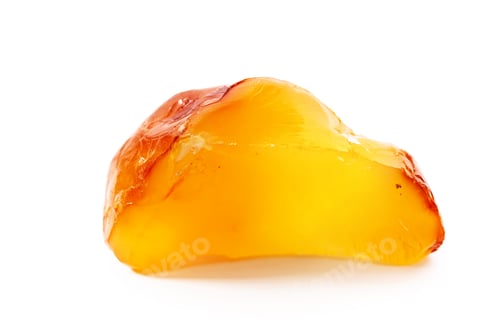 Preview: Natural amber. A piece of yellow opaque natural amber on white background