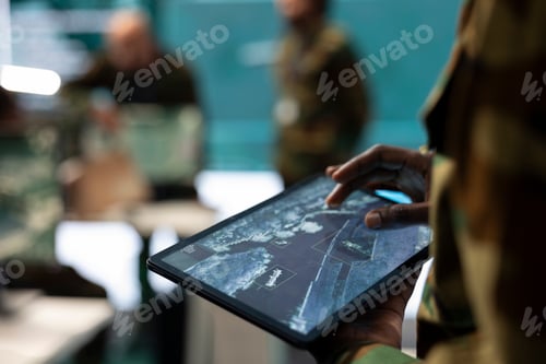 Preview: Recruit analyzing deployed infantry unit ongoing operation on his tablet