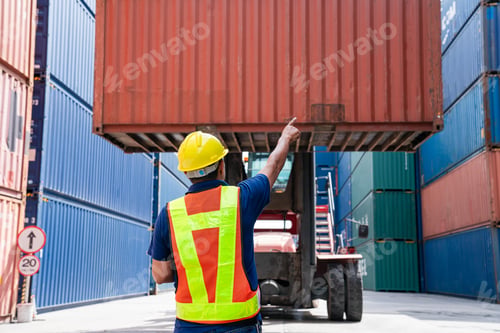 Preview: Container yard worker checking container at container yard warehouse.