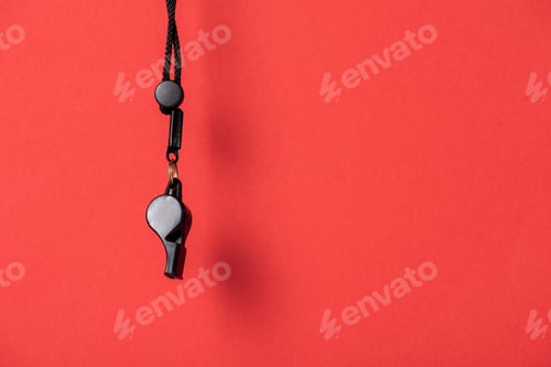 Preview: Black whistle with rope on red background