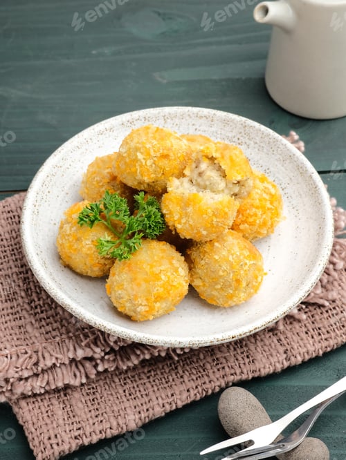 Preview: Plate of fried Arancini balls close up