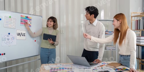 Preview: Creative UX Developer and UI Designer Brainstorming Session in Modern Office Environment