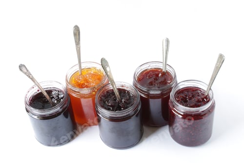 Preview: Jam jar filled with blueberry, peach, blackberry, strawberry and raspberry preserves. On white.