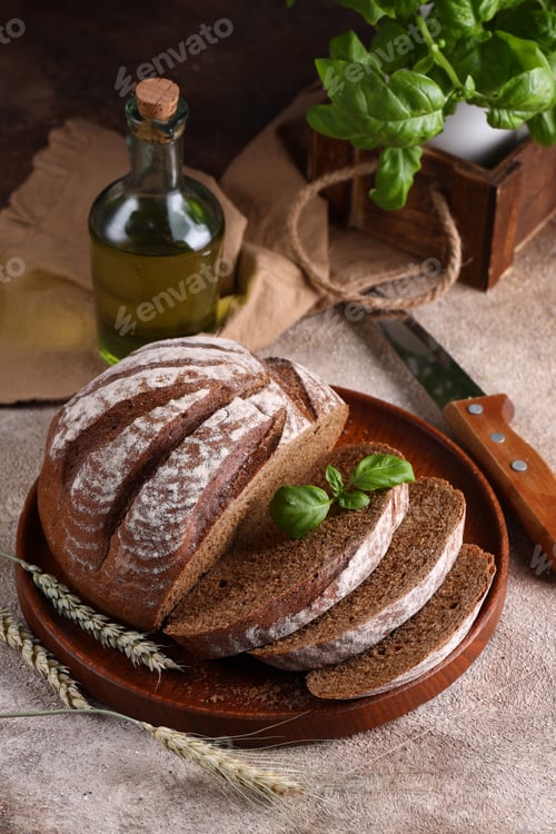 Dark Bread Loaf and Olive Oil Still Life