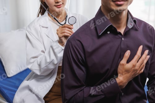 Preview: Doctor listening to patient's heart during routine examination