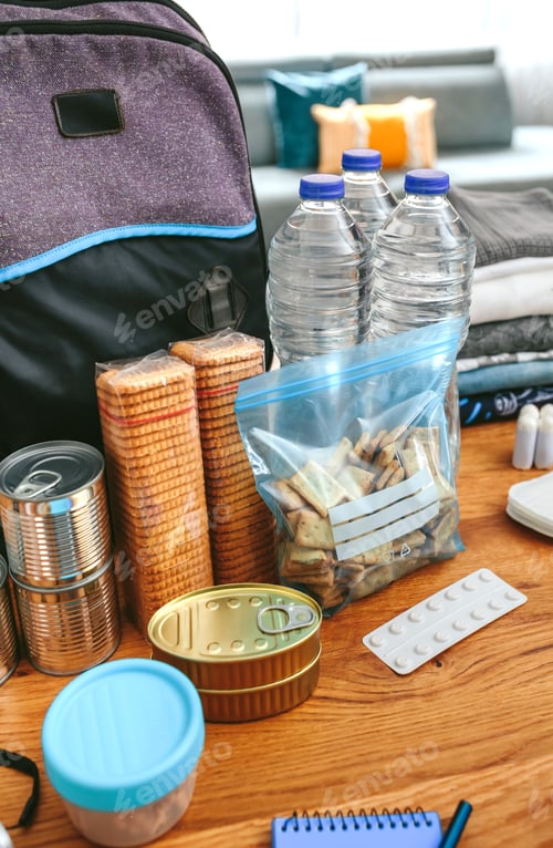 Preview: Emergency backpack equipment organized on the table