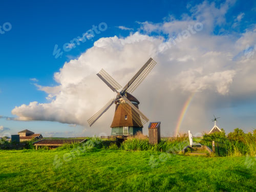 Preview: Landscape with windmill and rainbow. Dutch. A huge cloud after a storm. Agricultural fields
