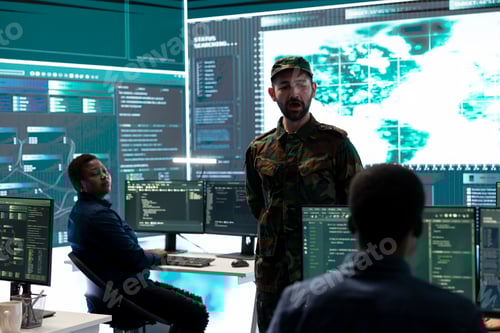 Preview: Military hackers working on cyber security in a high tech government center