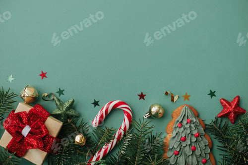 Preview: Christmas flat lay. Stylish christmas border with festive decorations on green background