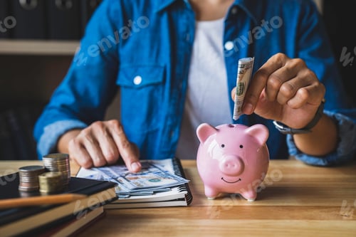 Preview: Woman folds dollar bills into pig piggy bank to save money for the future. after retirement and reco