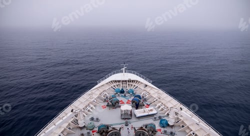 Preview: Bow of ship moving through heavy fog, with motion blur on waves.