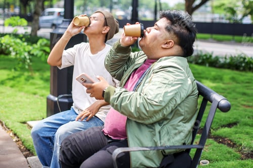 Preview: Two Young Guy Best Friends Sitting on Bench