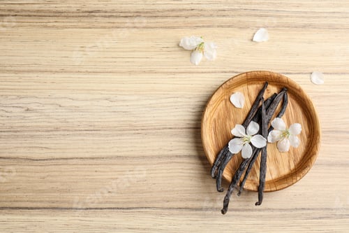 Preview: Flat lay composition with aromatic vanilla sticks and flowers on wooden background, space for text