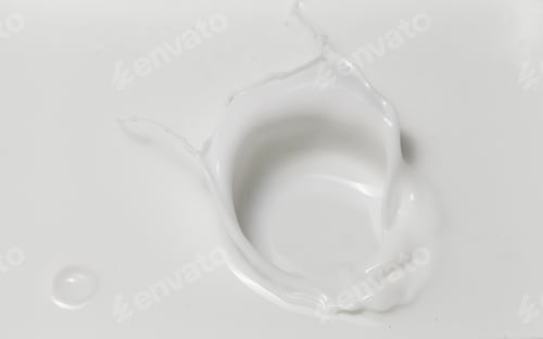 Preview: Fresh milk pouring making a crown splash in a milk pool. Top view, isolated on grey-white background