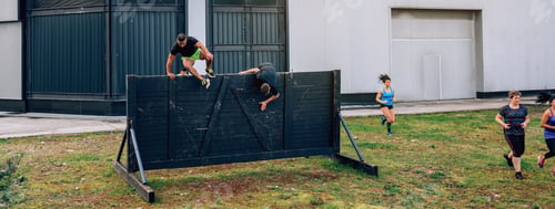 Preview: Participants in obstacle course running and climbing wall