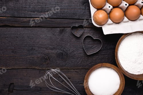 Preview: Kitchen tools, flour and sugar on a wooden background
