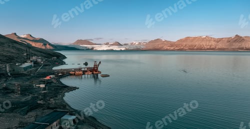 Preview: Exploring the abandoned structures of Pyramiden village by the calm waters in Svalbard