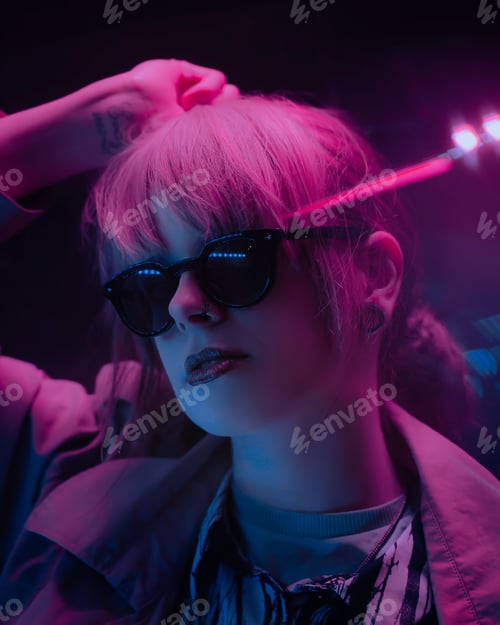 Preview: Night photo of a Hipster style fashion model in Neon Lights, includes a colorful / pink reflections.