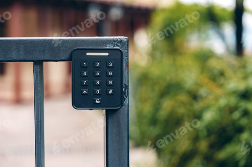 Preview: Keypad access control on a metal gate outside a building in a residential area