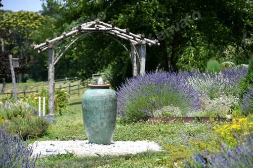 Preview: A fountain water feature at a lavender farm with colorful flower garden fields and rustic fences