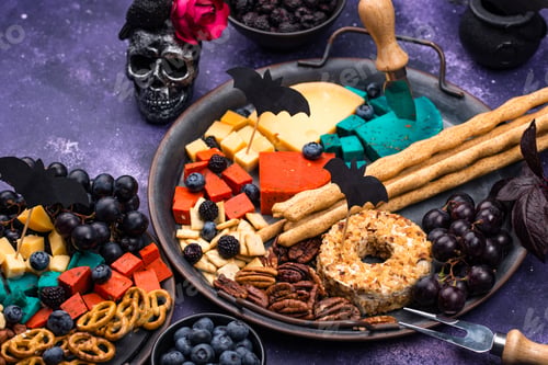 Preview: Halloween appetizers. Cheese plate with snacks