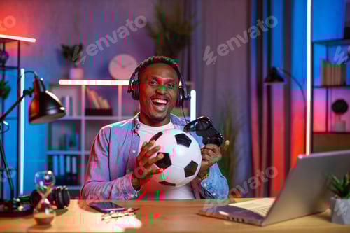 Preview: Man in headset using joystick and laptop for playing games