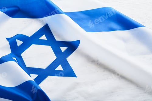 Preview: Independence Day of Israel. National Israel flag with star of David over white wooden background. Cl