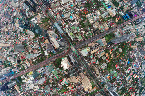 Preview: Aerial view of Sathorn intersection or junction with cars traffic, Bangkok Downtown. Thailand.