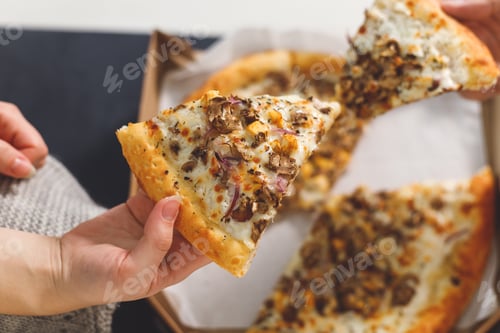 Preview: young couple eating pizza. Top view hands with pizza