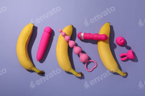 Preview: A collection of sex toys on a purple background.